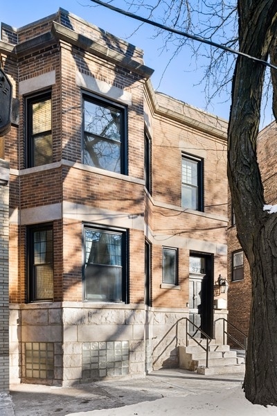 3721 North Racine Avenue Chicago, IL 60613 - Photo 1 of 28 a front view of a house with garage
