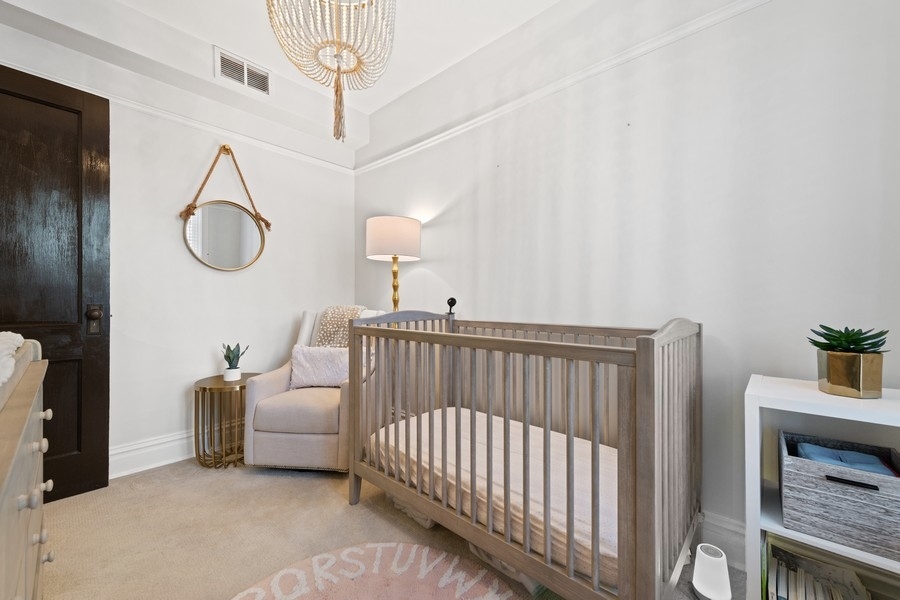 3721 North Racine Avenue Chicago, IL 60613 - Photo 20 of 28 a bedroom with furniture and a window