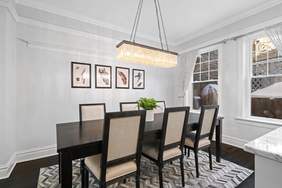 3721 North Racine Avenue Chicago, IL 60613 - Photo 9 of 28 a view of a dining room with furniture and window