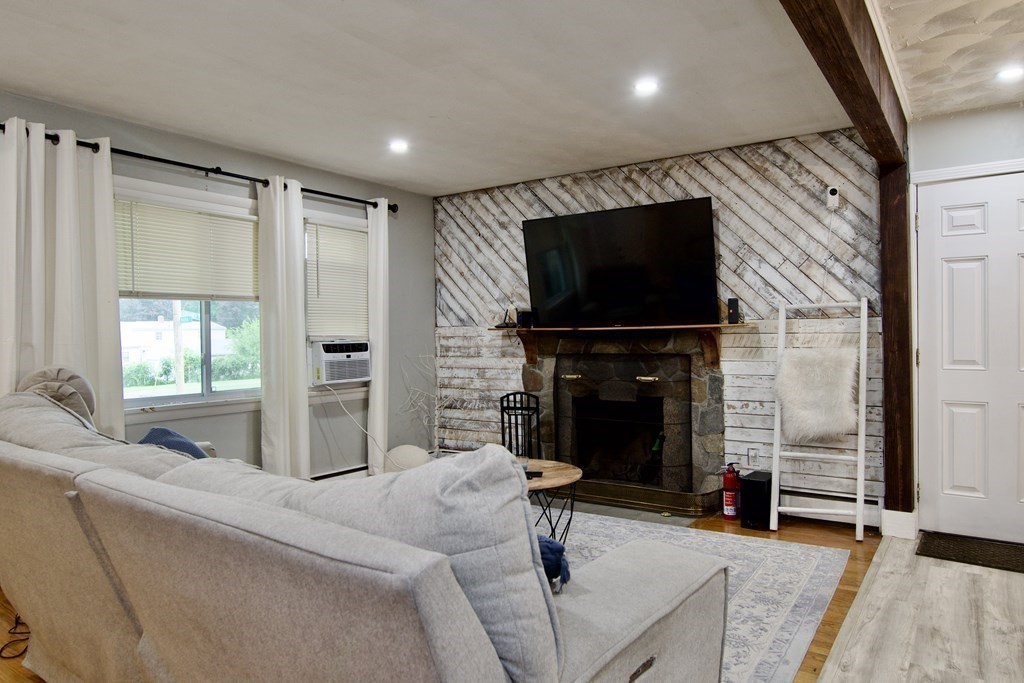 37 Greaney Street Springfield, MA 01104 - Photo 20 of 40 a living room with fireplace furniture and a flat screen tv