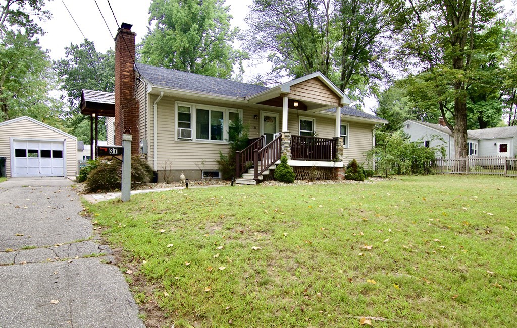 37 Greaney Street Springfield, MA 01104 - Photo 2 of 40 a front view of a house with yard and green space