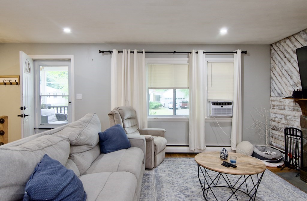 37 Greaney Street Springfield, MA 01104 - Photo 21 of 40 a living room with furniture and a large window