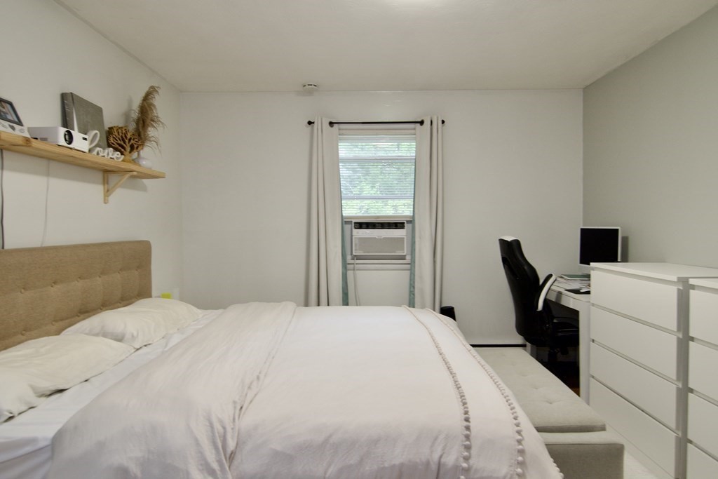 37 Greaney Street Springfield, MA 01104 - Photo 27 of 40 a bedroom with a bed and a desk