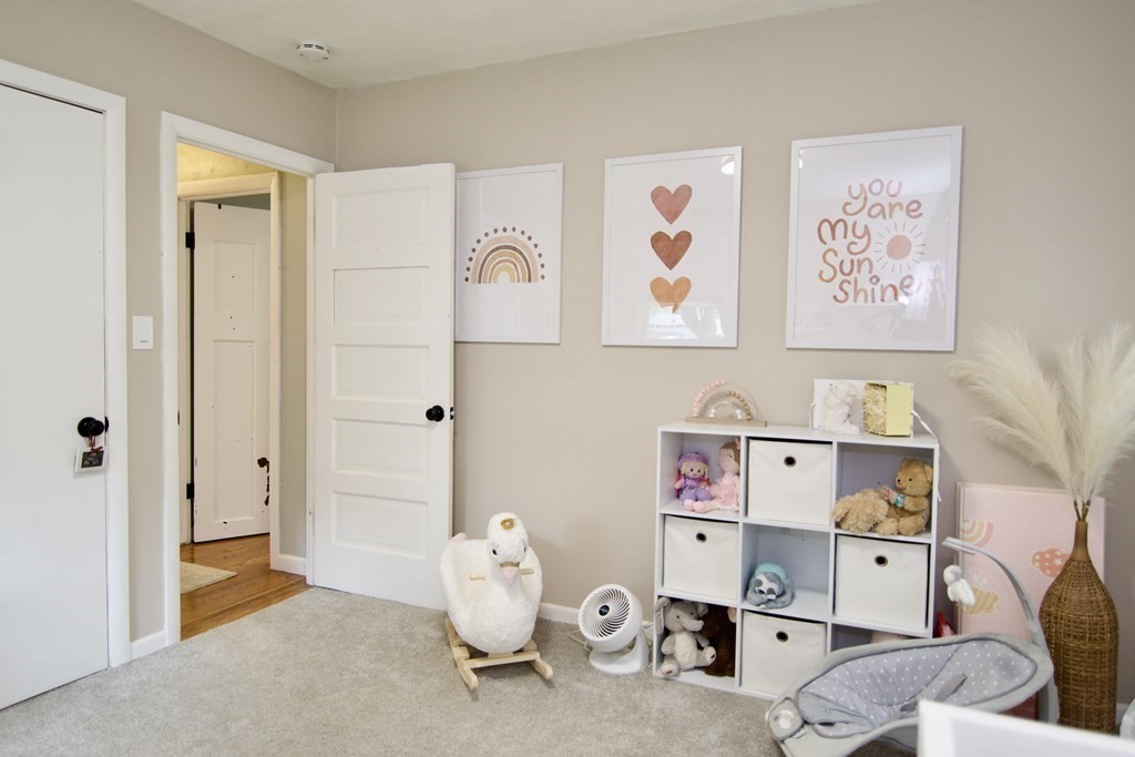 37 Greaney Street Springfield, MA 01104 - Photo 32 of 40 a view of room with guitars and shelf