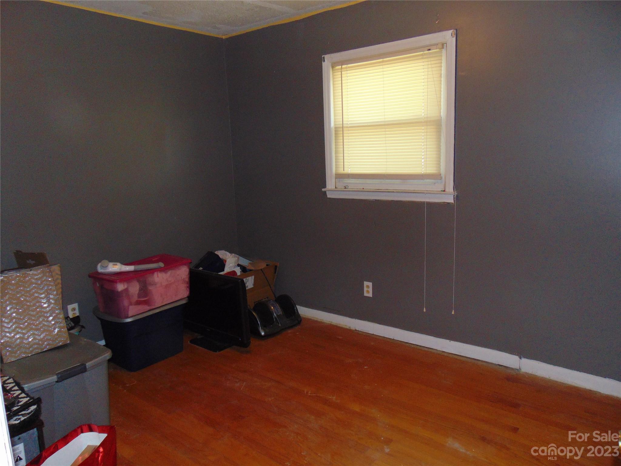 1200 Stallings Road Matthews, NC 28104 - Photo 11 of 17 a bedroom with a bed and a window
