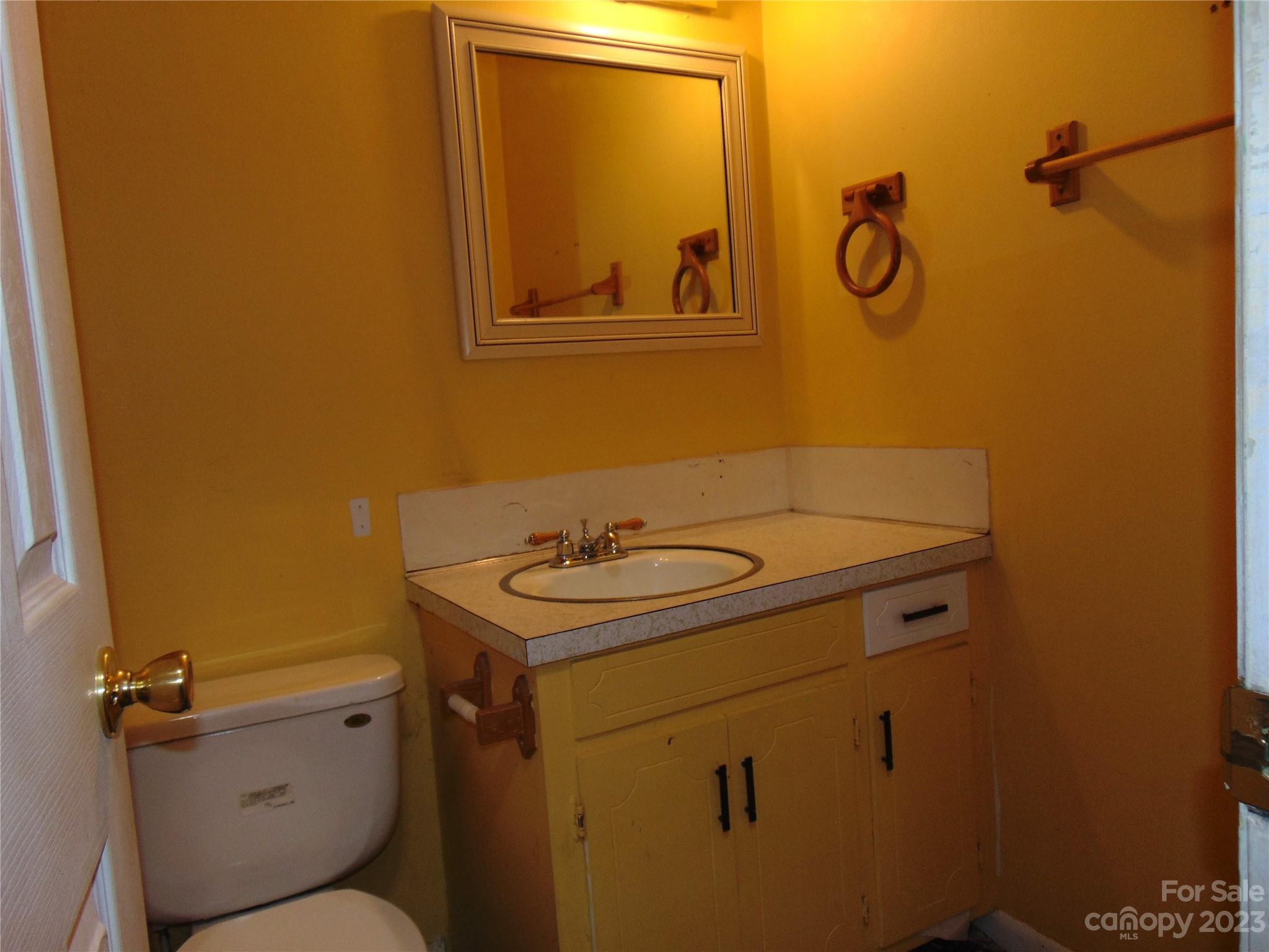 1200 Stallings Road Matthews, NC 28104 - Photo 12 of 17 a bathroom with a sink and a toilet