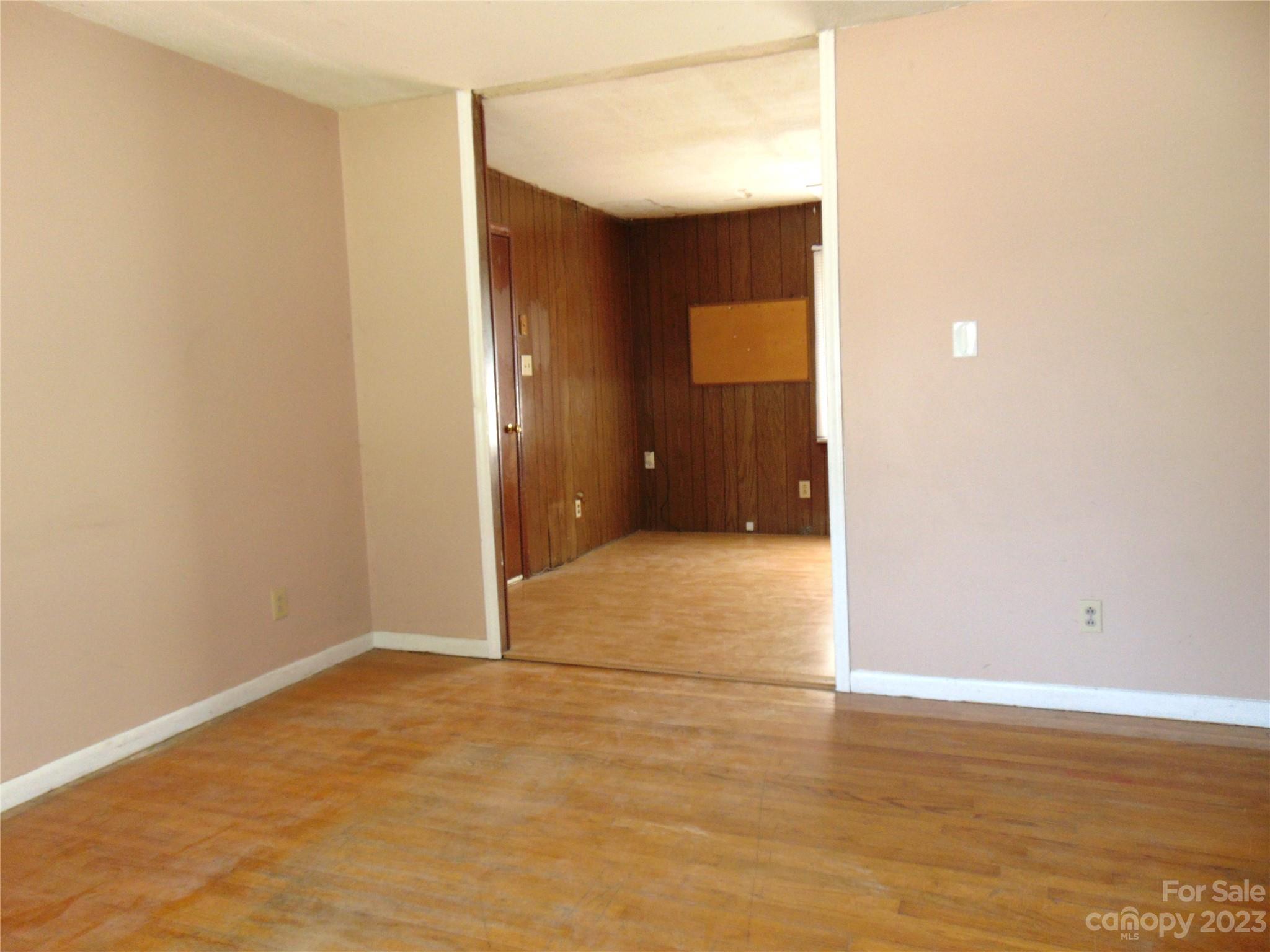 1200 Stallings Road Matthews, NC 28104 - Photo 3 of 17 a view of an empty room with wooden floor