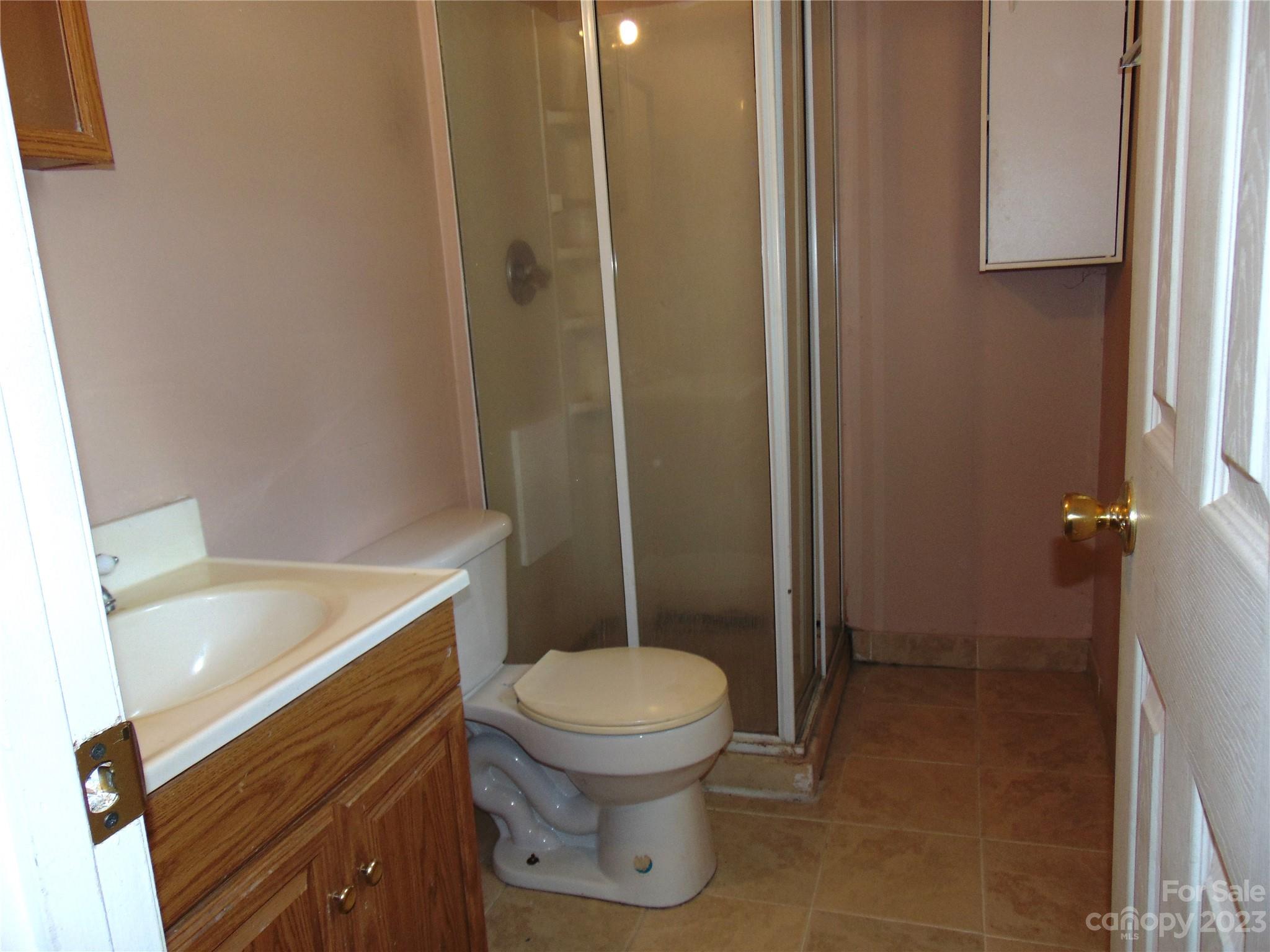 1200 Stallings Road Matthews, NC 28104 - Photo 9 of 17 a bathroom with a toilet and a shower