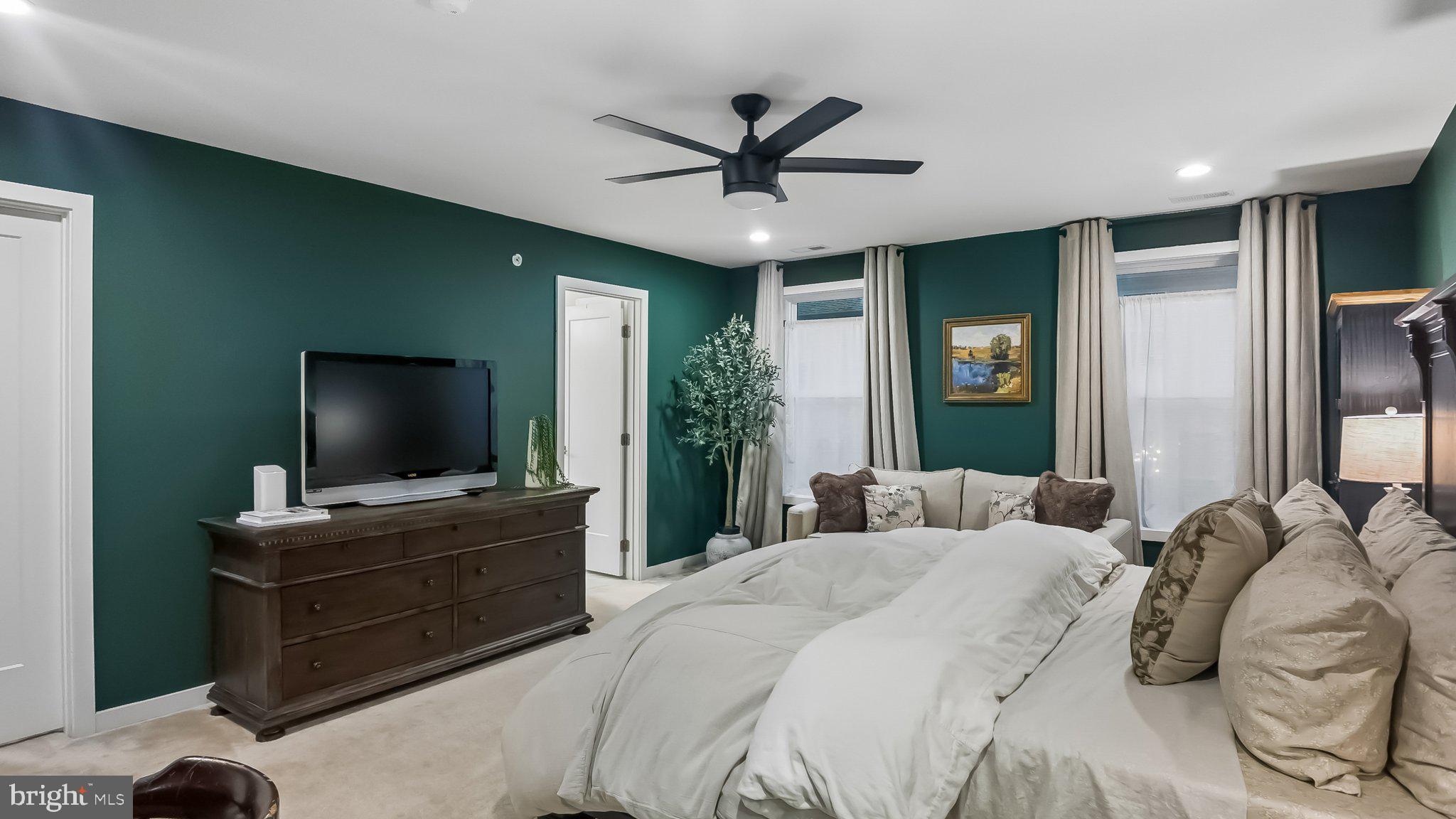 257 Junction Road Media, PA 19063 - Photo 13 of 25 a bedroom with a bed and a flat screen tv
