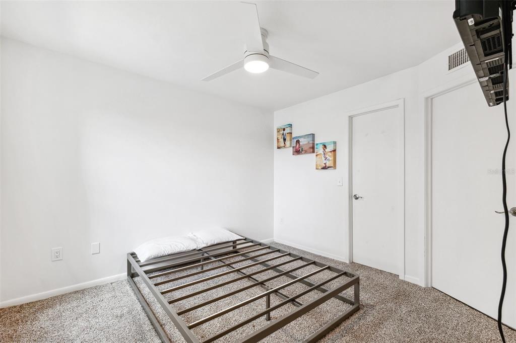 5712 Biscayne Court, Unit 103 New Port Richey, FL 34652 - Photo 16 of 31 a view of room with wooden floor and white walls