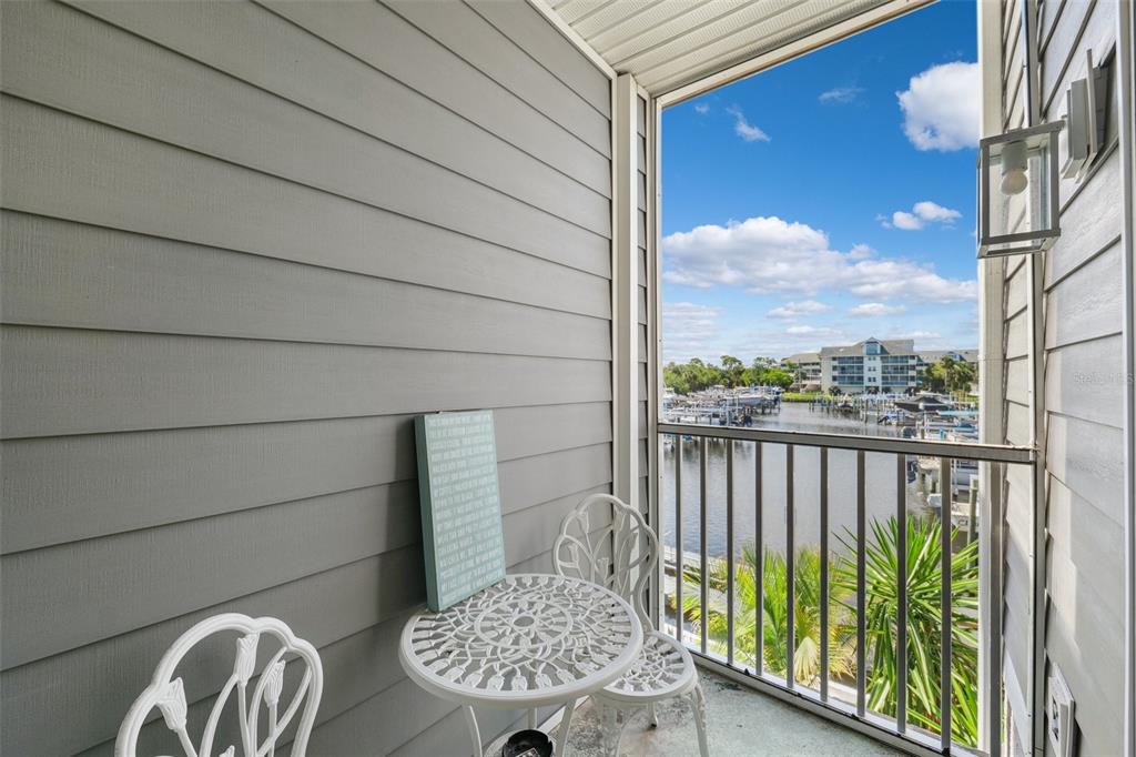 5712 Biscayne Court, Unit 103 New Port Richey, FL 34652 - Photo 19 of 31 a view of balcony with wooden floor