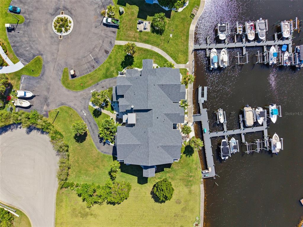 5712 Biscayne Court, Unit 103 New Port Richey, FL 34652 - Photo 2 of 31 an aerial view of a house with a swimming pool