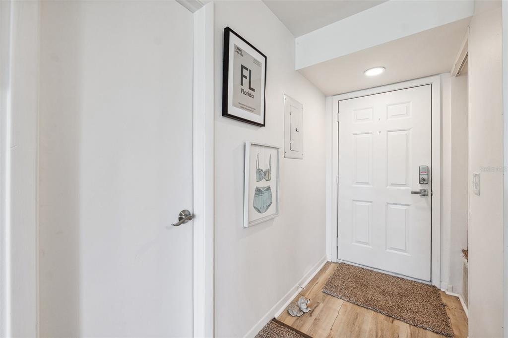 5712 Biscayne Court, Unit 103 New Port Richey, FL 34652 - Photo 5 of 31 a view of a hallway with front door