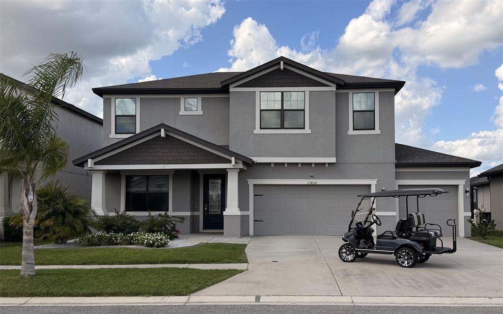 13850 Moosehead Circle Hudson, FL 34669 - Photo 1 of 71 a front view of a house with a garden