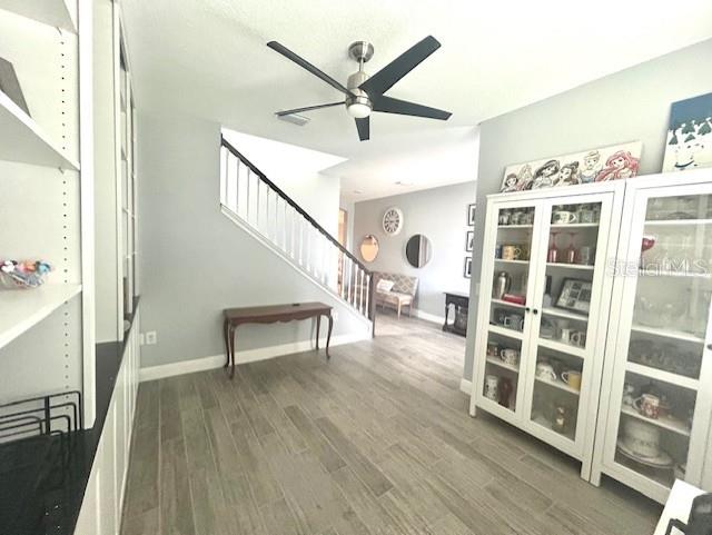 13850 Moosehead Circle Hudson, FL 34669 - Photo 11 of 71 a view of a livingroom with wooden floor and a ceiling fan