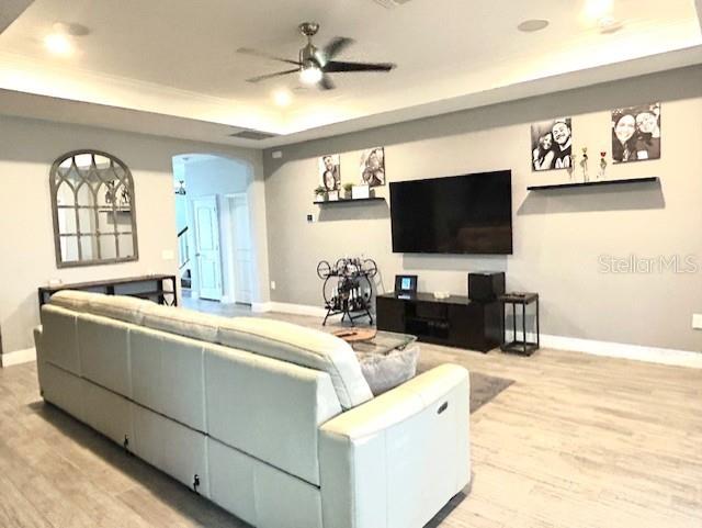 13850 Moosehead Circle Hudson, FL 34669 - Photo 15 of 71 a living room with furniture and a flat screen tv