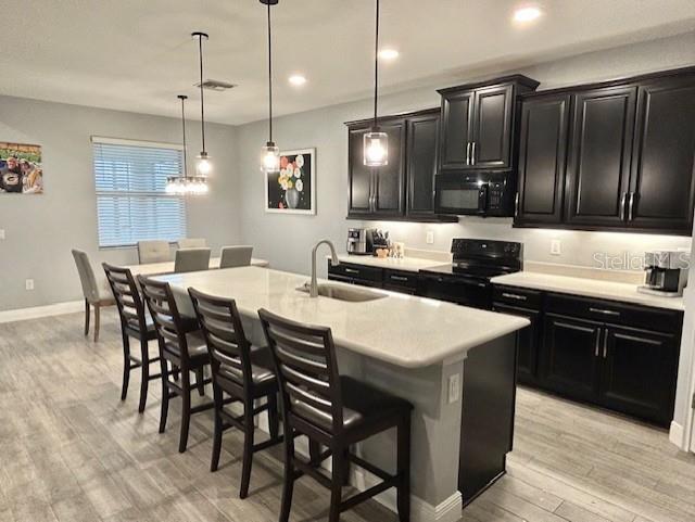 13850 Moosehead Circle Hudson, FL 34669 - Photo 16 of 71 a large kitchen with a table and chairs