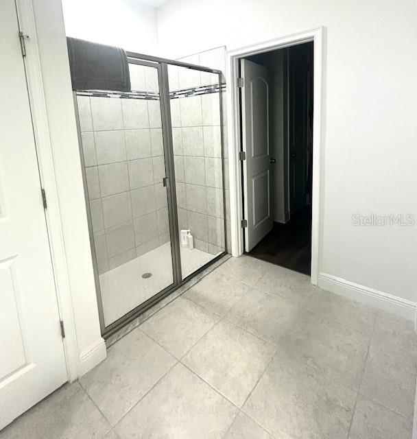 13850 Moosehead Circle Hudson, FL 34669 - Photo 22 of 71 a view of a bathroom with a glass door shower
