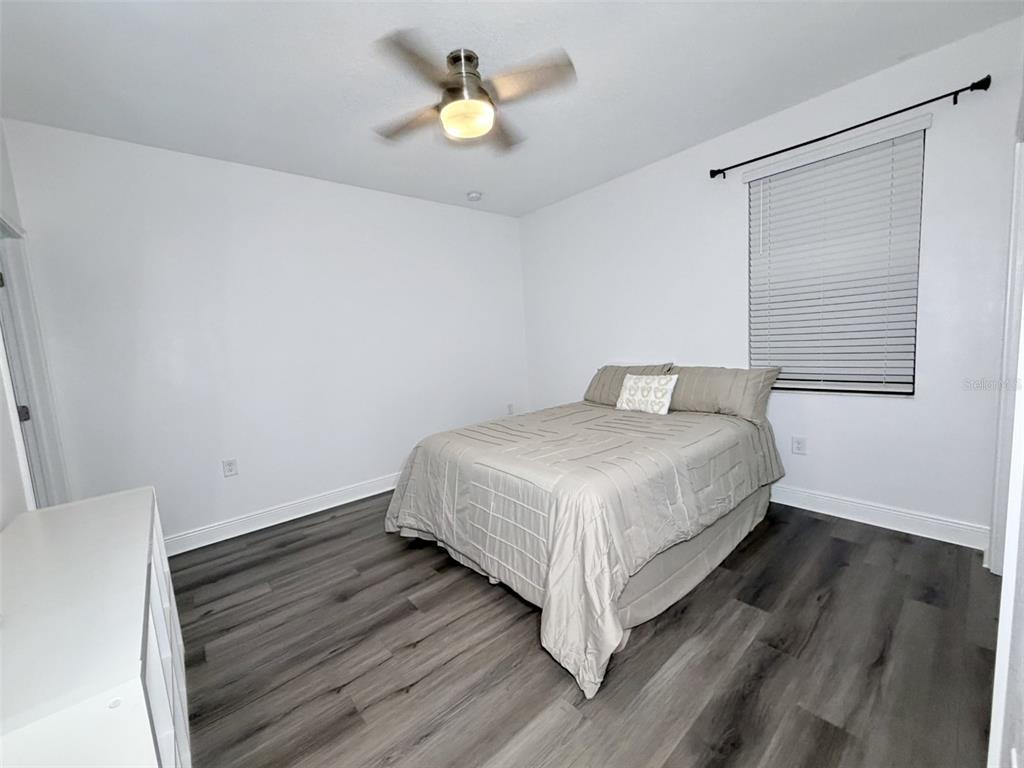 13850 Moosehead Circle Hudson, FL 34669 - Photo 28 of 71 a bedroom with a bed and a window