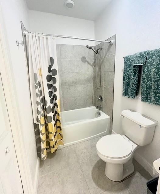 13850 Moosehead Circle Hudson, FL 34669 - Photo 35 of 71 a bathroom with a toilet and a bathtub
