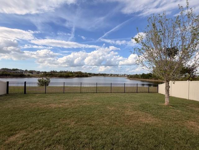 13850 Moosehead Circle Hudson, FL 34669 - Photo 40 of 71 a view of a field with trees in the background