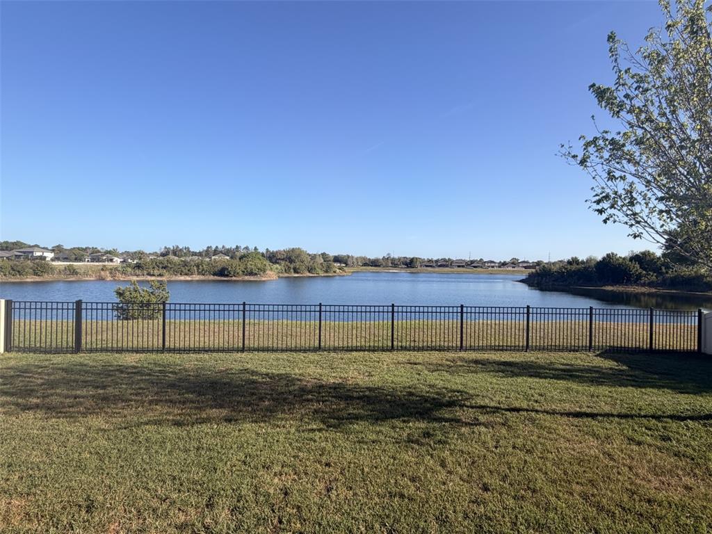 13850 Moosehead Circle Hudson, FL 34669 - Photo 4 of 71 a view of a lake with a big yard