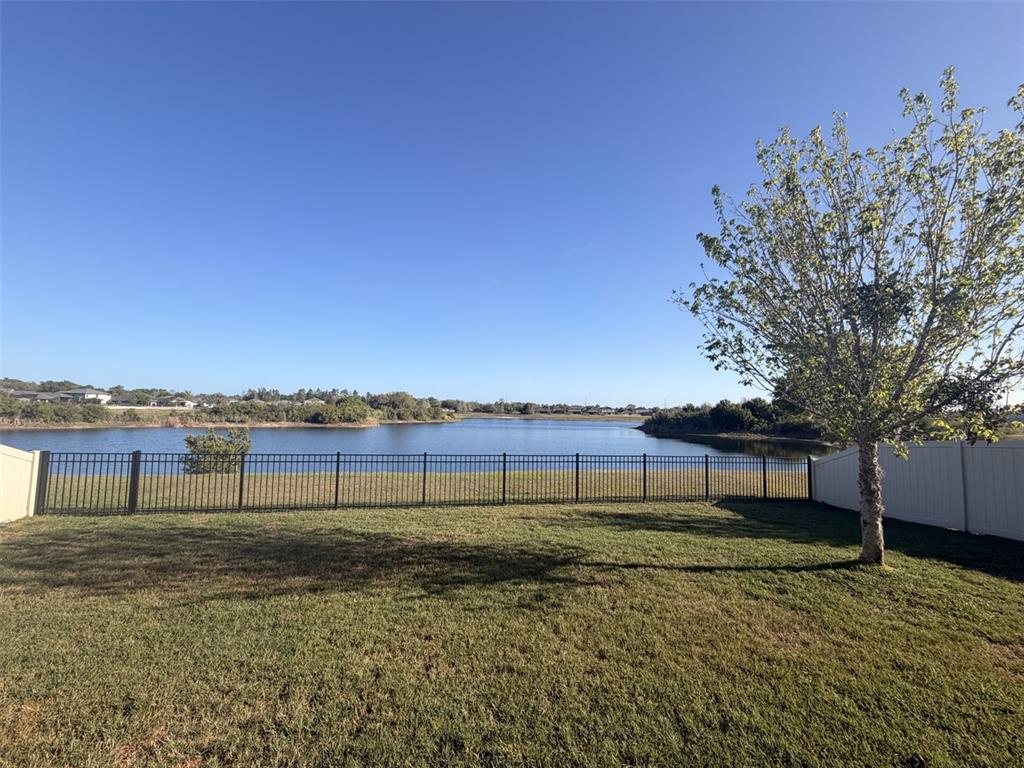 13850 Moosehead Circle Hudson, FL 34669 - Photo 41 of 71 a view of a lake with a big yard