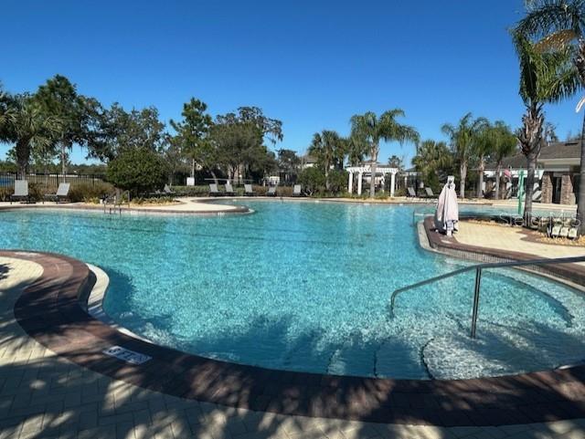 13850 Moosehead Circle Hudson, FL 34669 - Photo 51 of 71 a view of a garden with lawn chairs