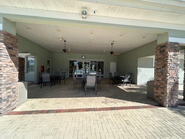 13850 Moosehead Circle Hudson, FL 34669 - Photo 52 of 71 a view of a living room and kitchen