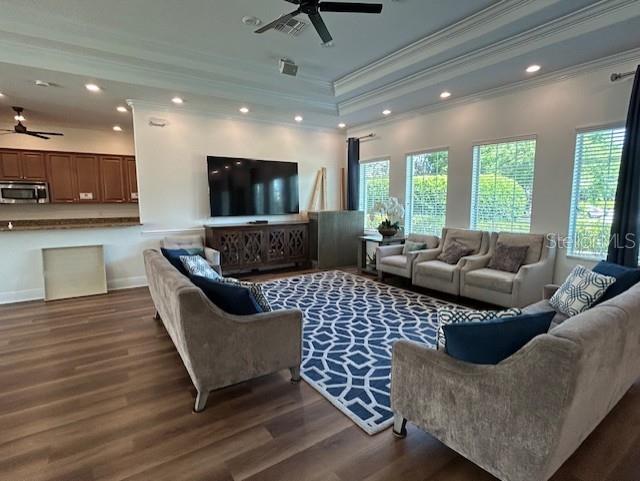 13850 Moosehead Circle Hudson, FL 34669 - Photo 55 of 71 a living room with furniture and a flat screen tv