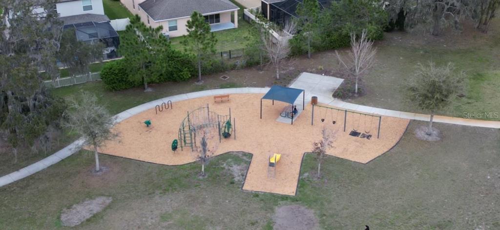 13850 Moosehead Circle Hudson, FL 34669 - Photo 59 of 71 an aerial view of a house with pool and yard