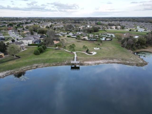 13850 Moosehead Circle Hudson, FL 34669 - Photo 71 of 71 an aerial view of a house with a yard and lake view