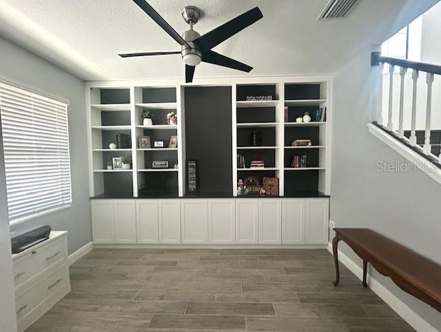 13850 Moosehead Circle Hudson, FL 34669 - Photo 9 of 71 a view of an empty room with a window and wooden floor