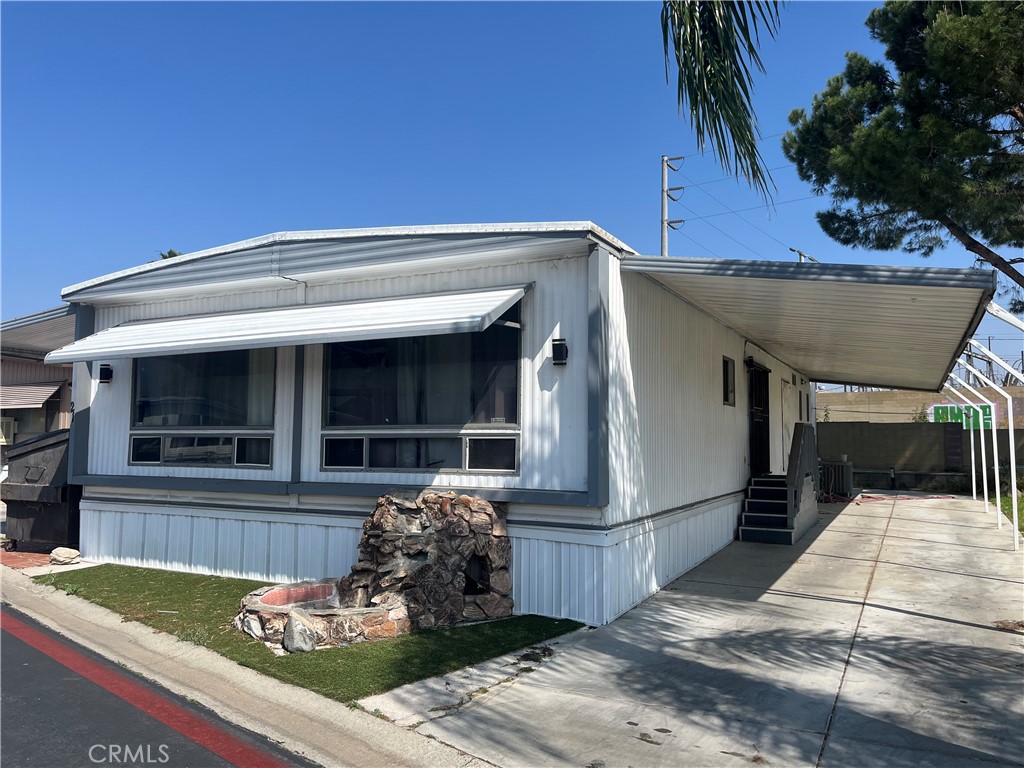 2930 West Rialto Avenue, Unit 21 Rialto, CA 92376 - Photo 2 of 5 a front view of a house with garden