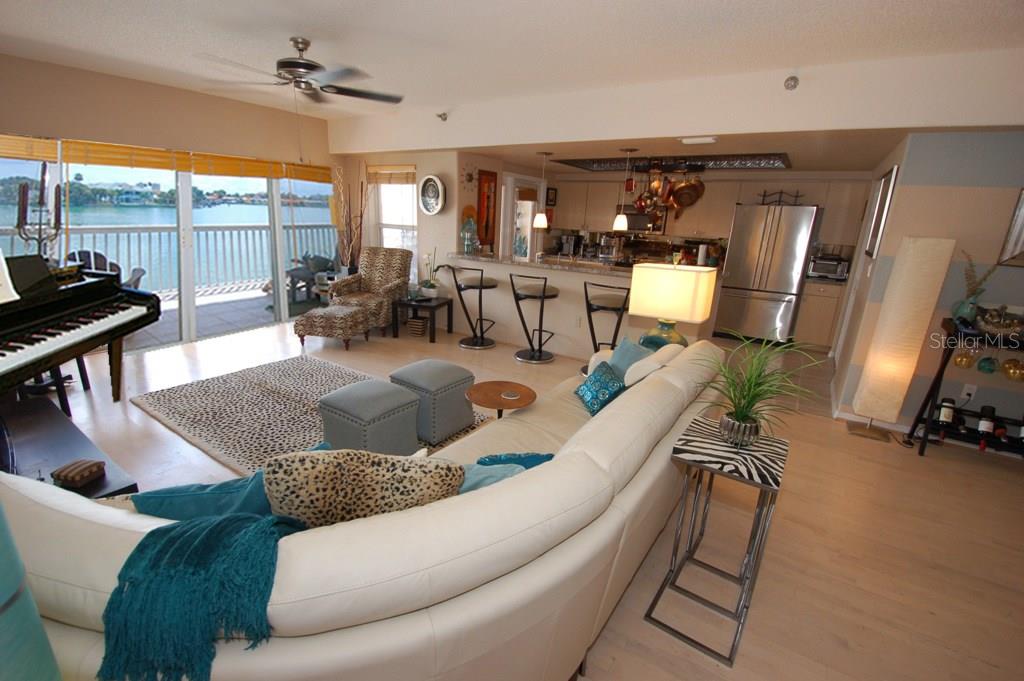9357 Blind Pass Road, Unit 104 St. Pete Beach, FL 33706 - Photo 3 of 25 Spacious living areas open to the kitchen perfect for entertaining