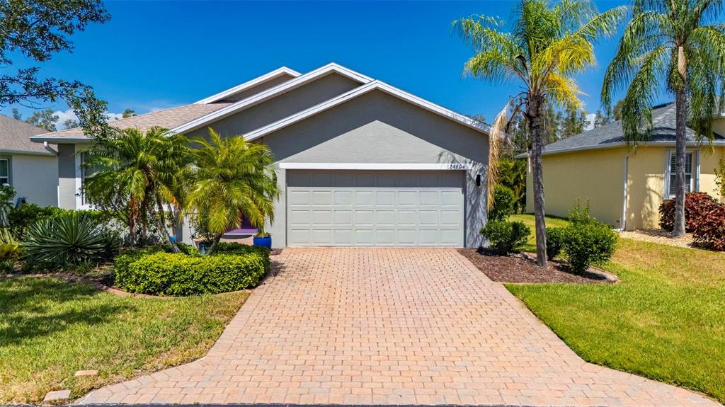 24604 Rio Villa Lakes Circle Punta Gorda, FL 33950 - Photo 4 of 28 a front view of a house with garden