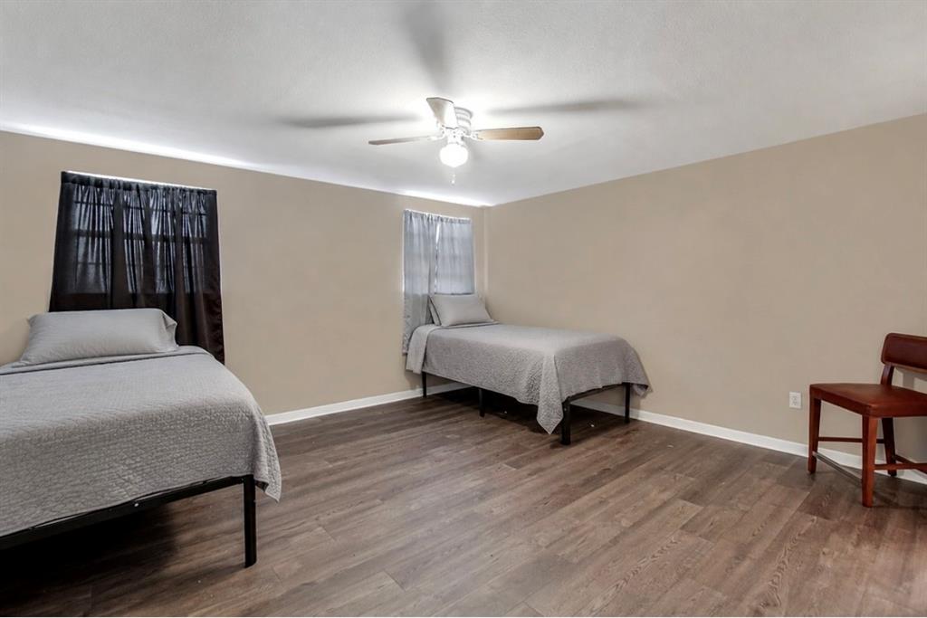 3952 J J Rendon Road Burleson, TX 76028 - Photo 13 of 25 One of the two spacious bedrooms upstairs, with a walk in closet and a private full size bathroom.