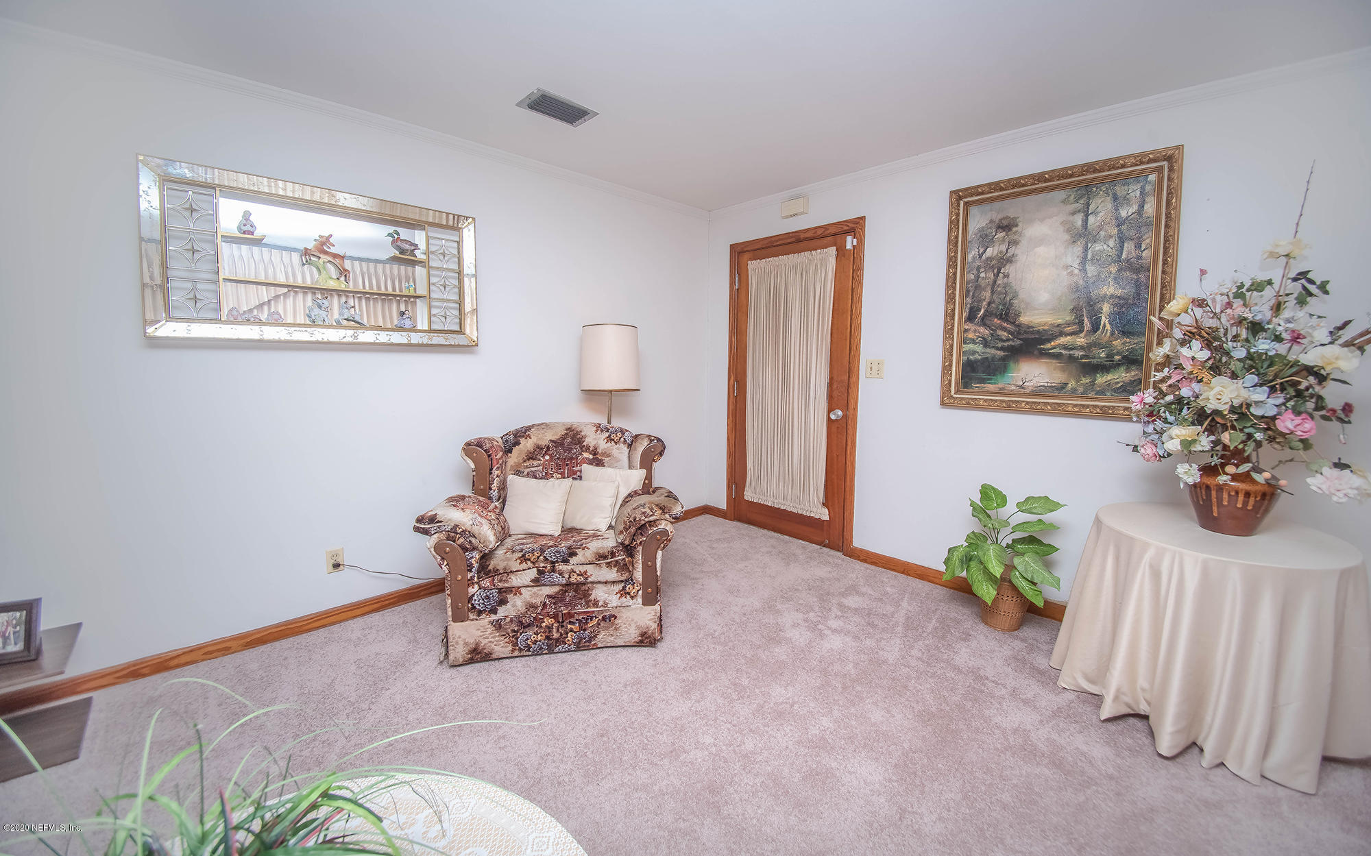 281105 Trigg Road Hilliard, FL 32046 - Photo 11 of 41 a dining room with furniture and a potted plant