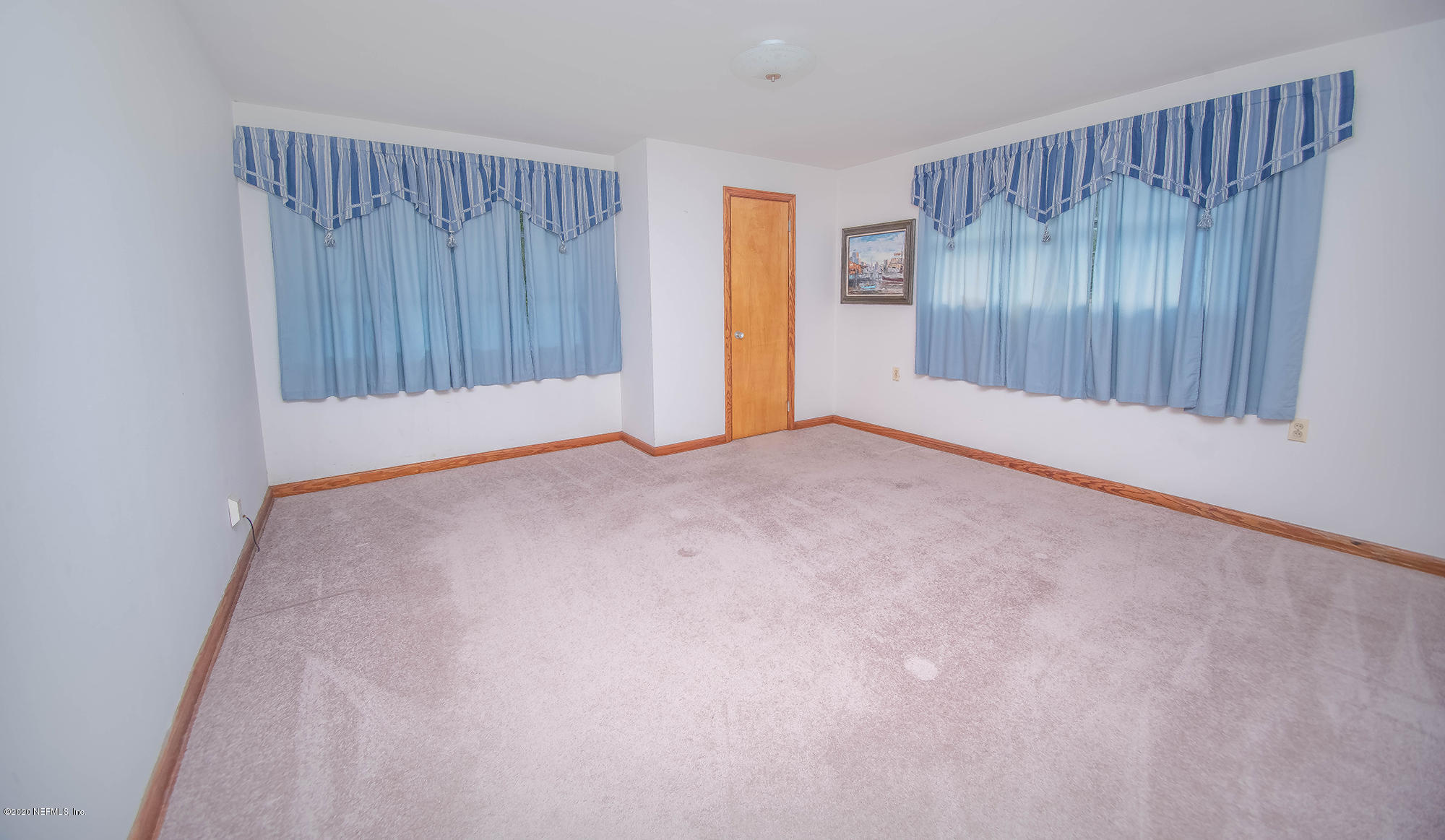 281105 Trigg Road Hilliard, FL 32046 - Photo 16 of 41 an empty room with wooden floor and a window