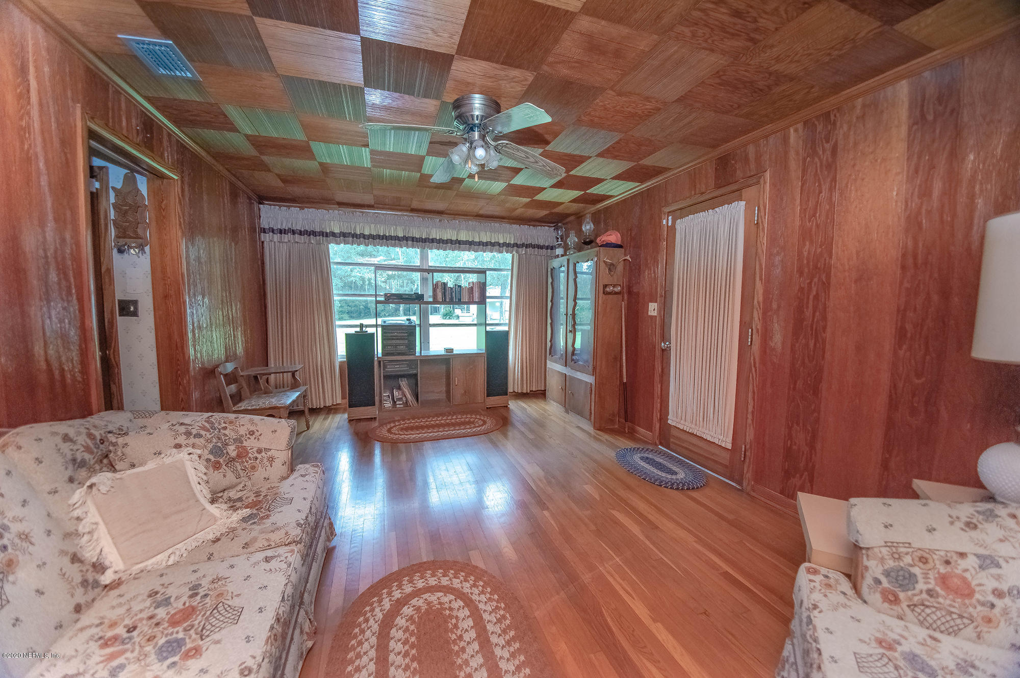 281105 Trigg Road Hilliard, FL 32046 - Photo 20 of 41 a view of a livingroom with wooden floor and furniture