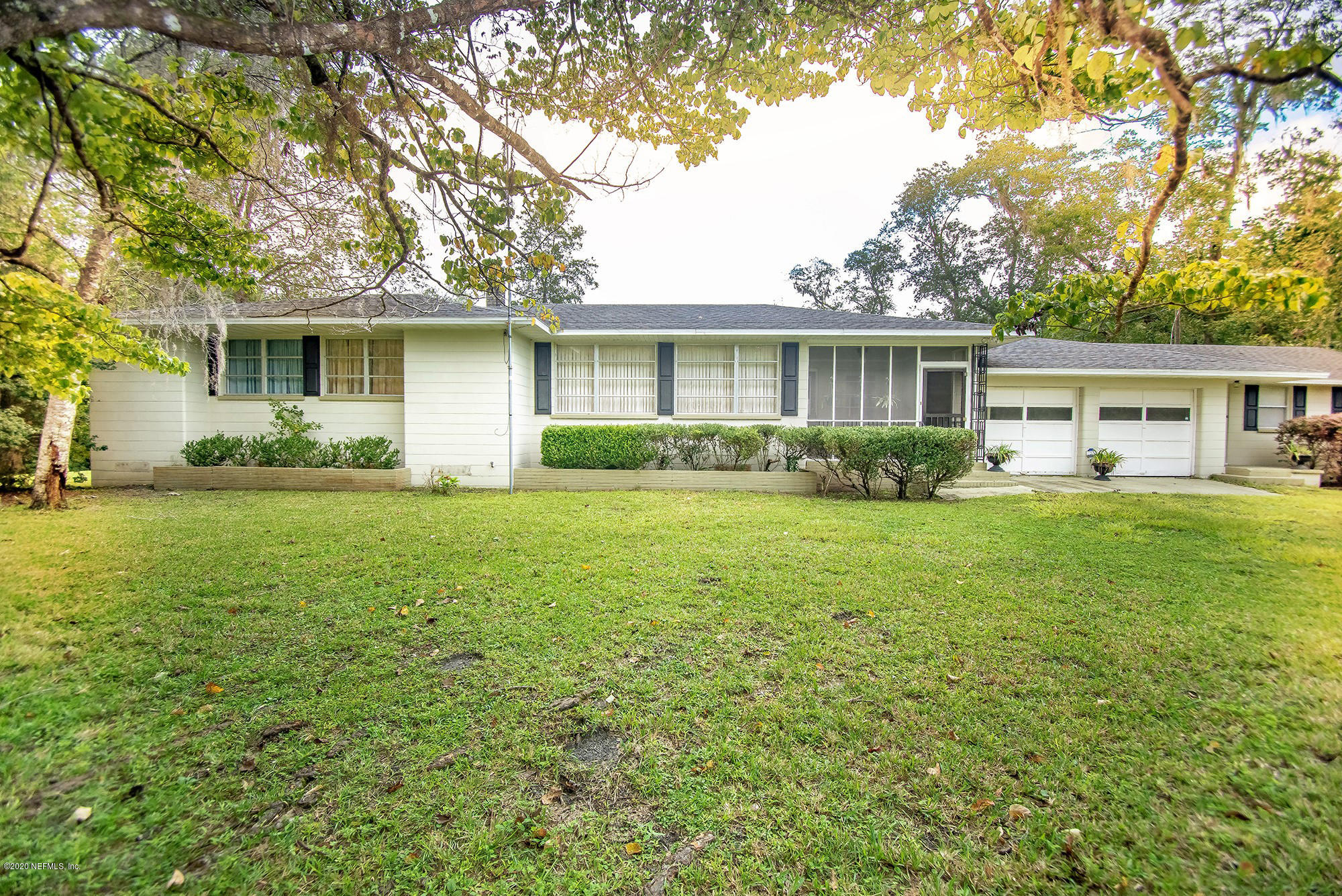 281105 Trigg Road Hilliard, FL 32046 - Photo 2 of 41 a front view of a house with garden