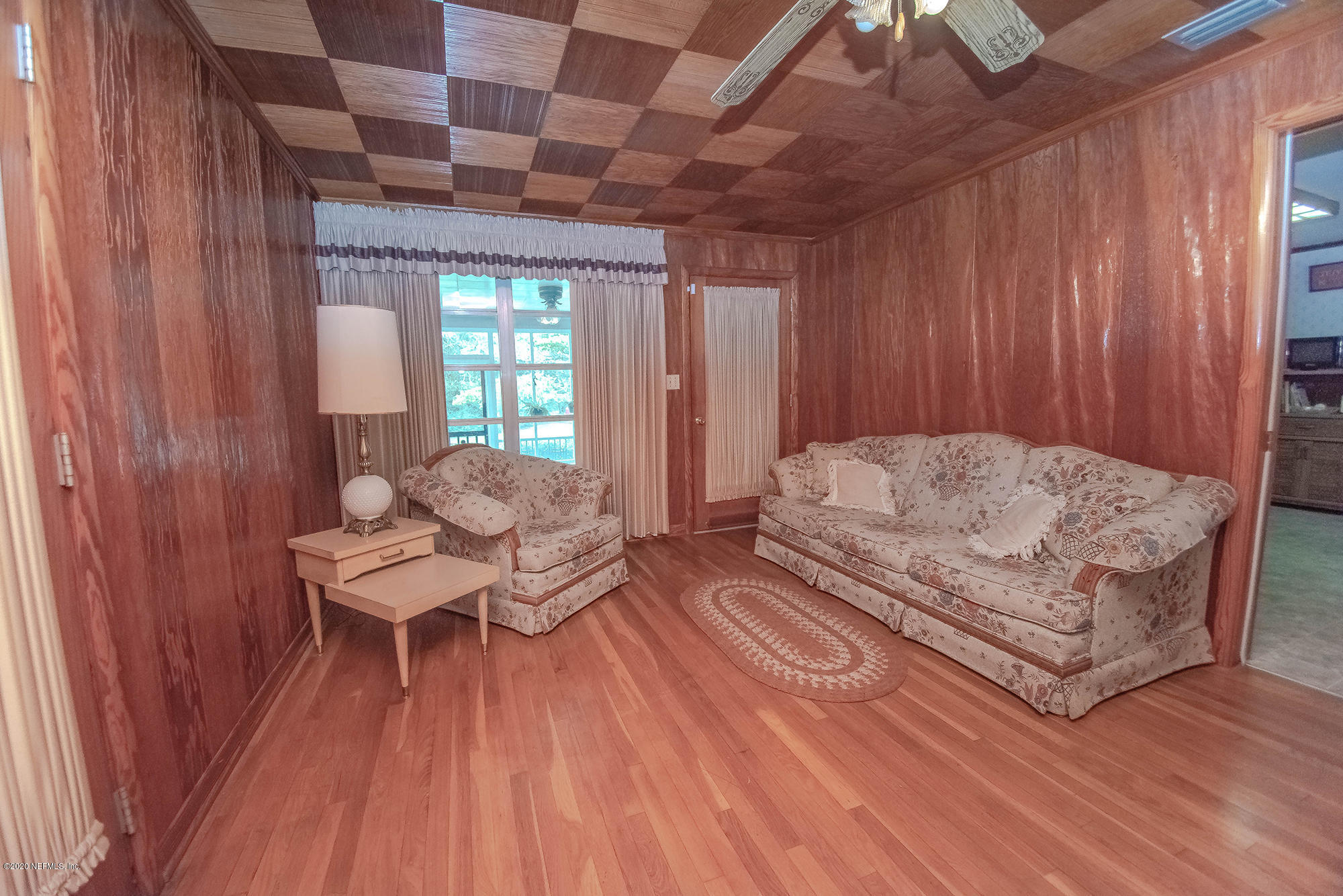 281105 Trigg Road Hilliard, FL 32046 - Photo 21 of 41 a living room with furniture and wooden floor