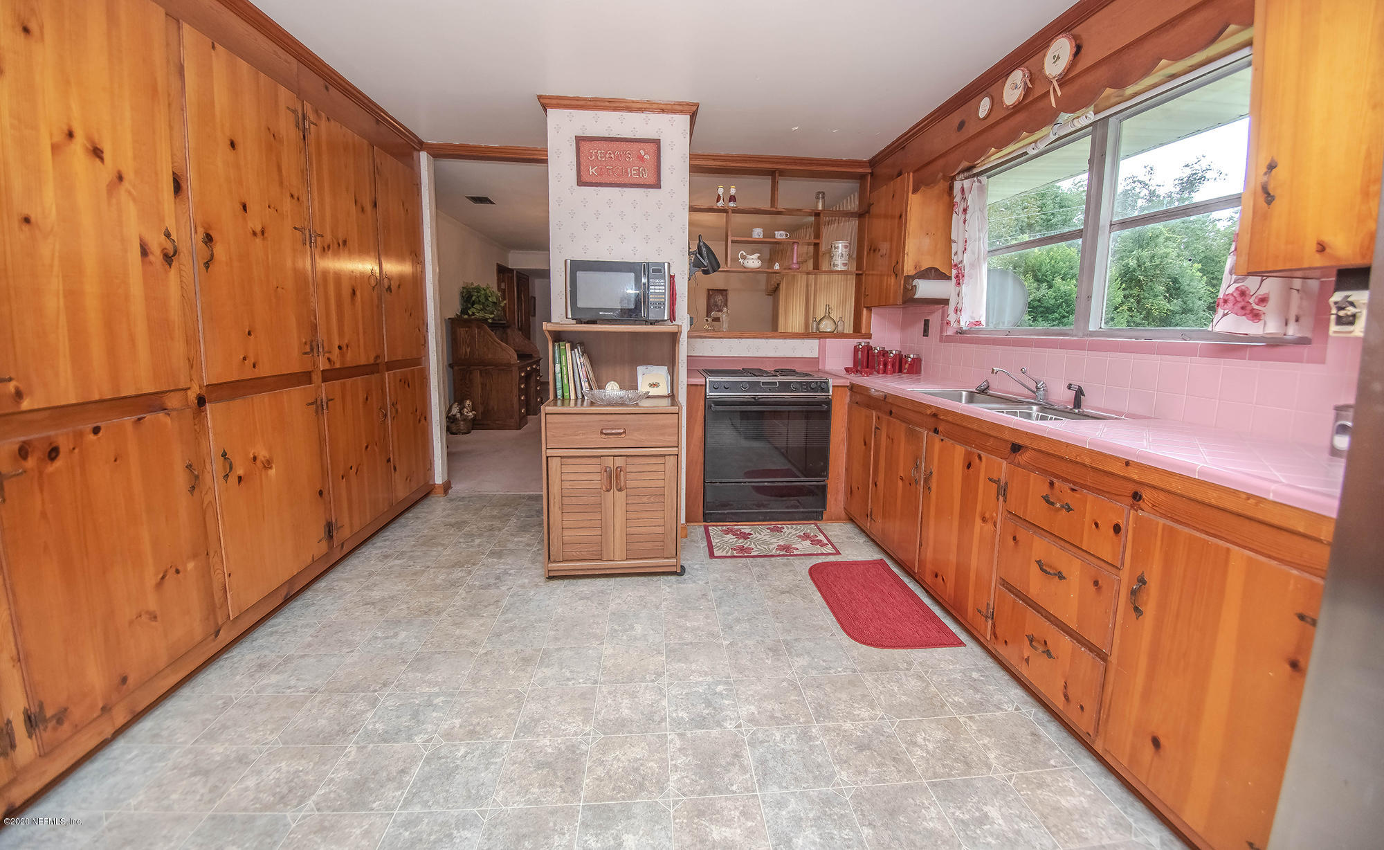 281105 Trigg Road Hilliard, FL 32046 - Photo 23 of 41 a kitchen with stainless steel appliances granite countertop a refrigerator and a sink