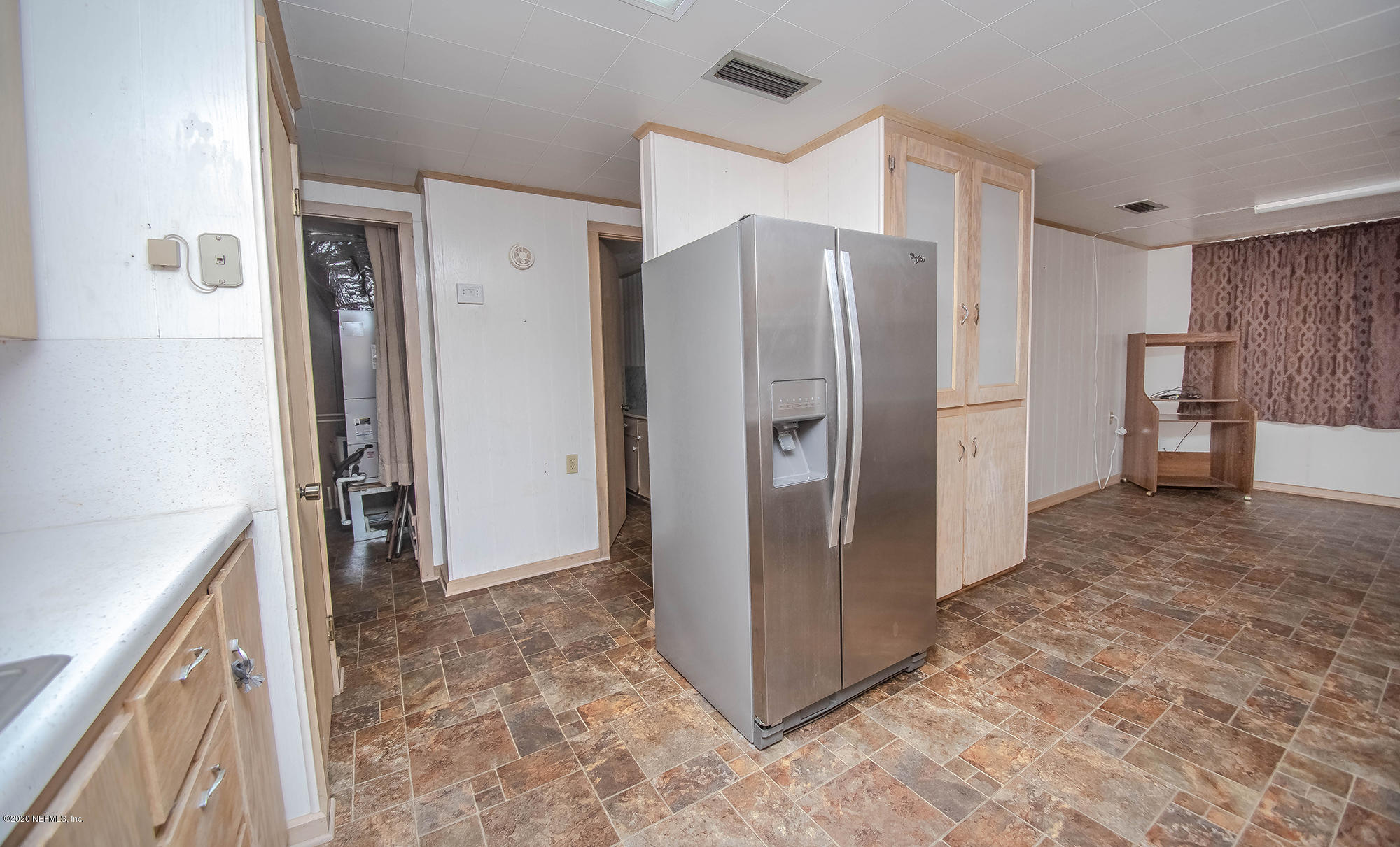 281105 Trigg Road Hilliard, FL 32046 - Photo 27 of 41 a view of a kitchen with a refrigerator and a sink