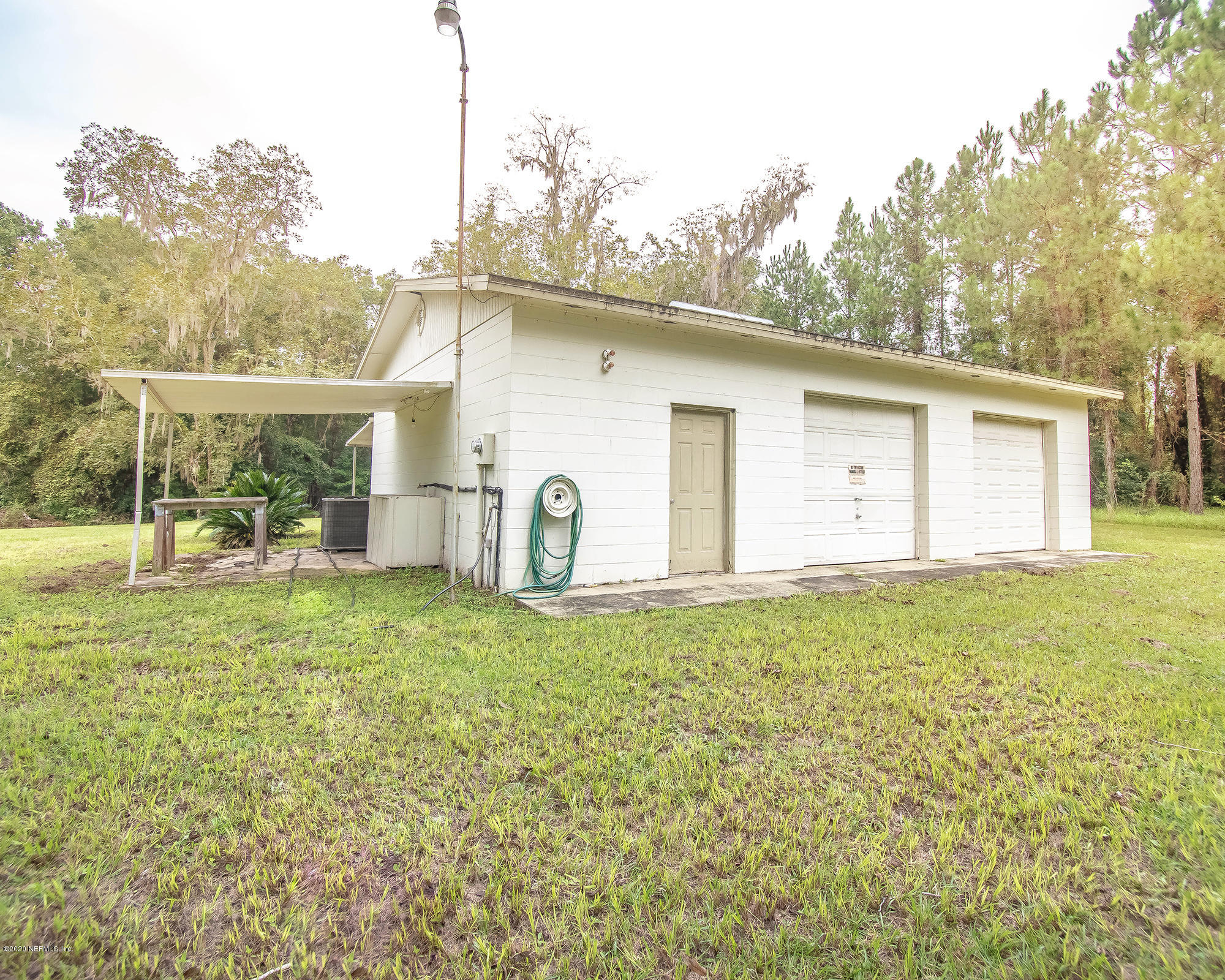 281105 Trigg Road Hilliard, FL 32046 - Photo 31 of 41 a view of a house with backyard
