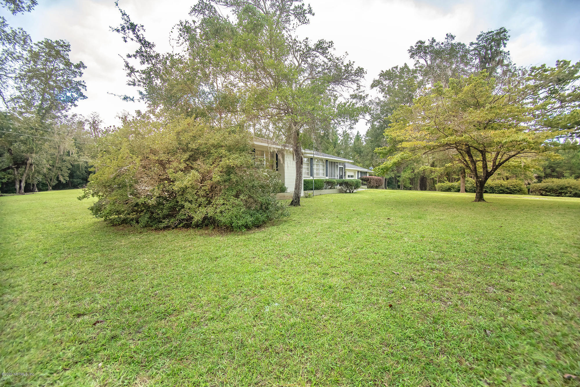 281105 Trigg Road Hilliard, FL 32046 - Photo 5 of 41 a view of yard with swimming pool and green space