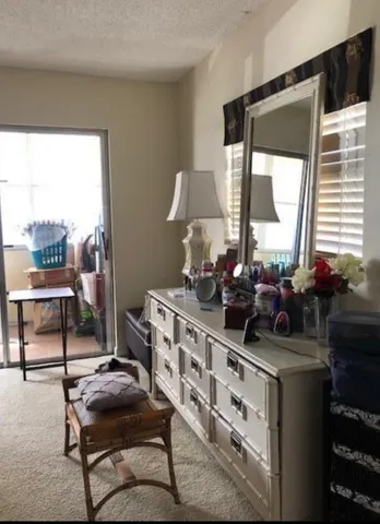 a room with furniture a window and a flat screen tv