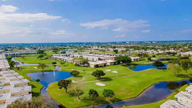 a view of a swimming pool with a table and chairs