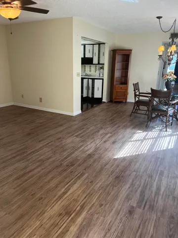 a view of a livingroom with furniture and wooden floor