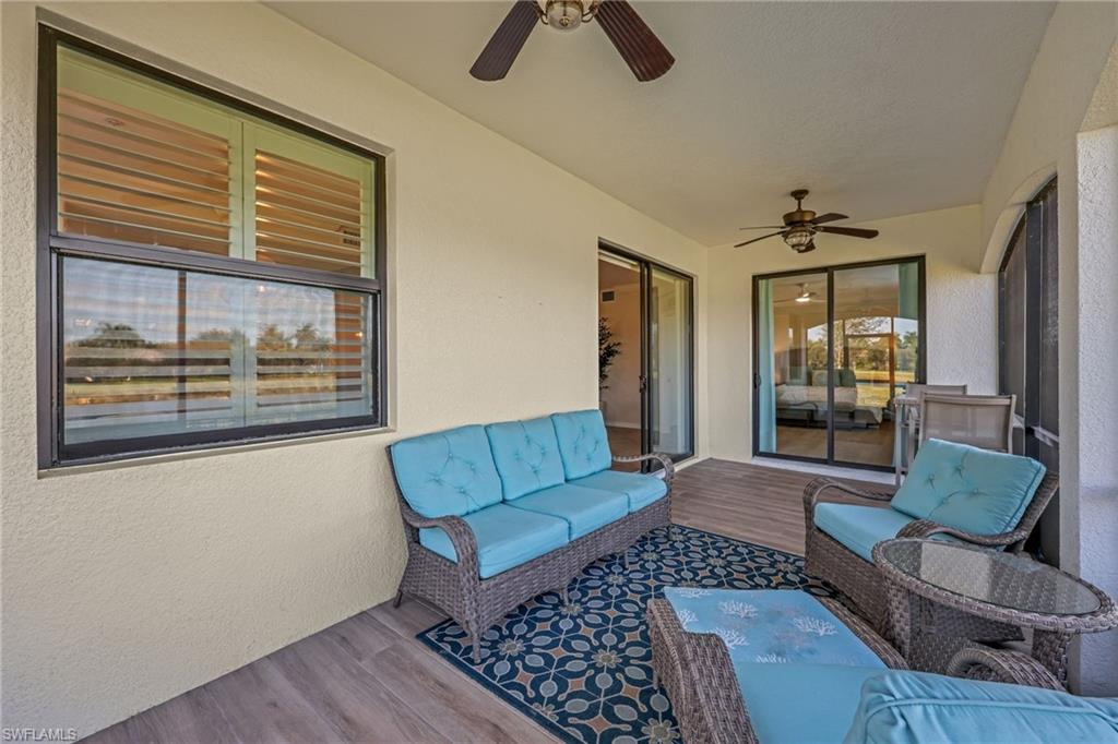3159 Serena Lane, Unit 102 Naples, FL 34114 - Photo 20 of 42 a living room with furniture and a window